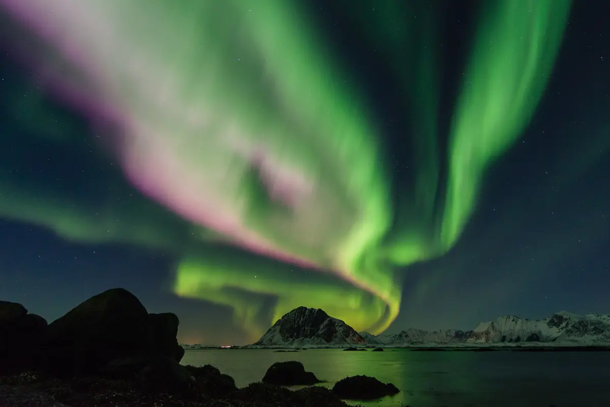 Green and purple northern lights over Lofoten